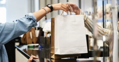 Woman buying from a golden mile galleria shop
