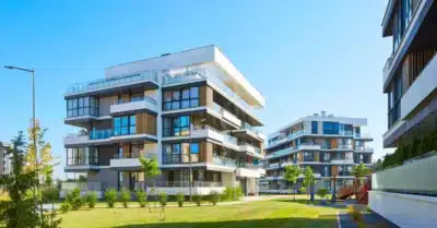 Modern residential apartment complex with landscaped green area