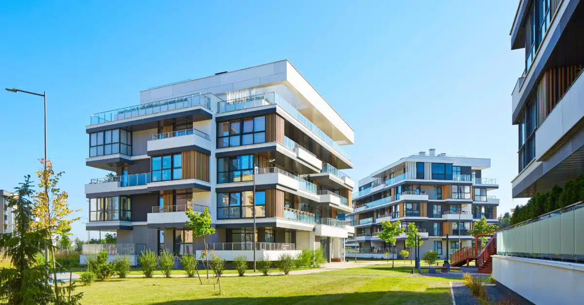 Modern residential apartment complex with landscaped green area