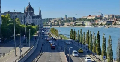 Road by the water with cars in both directions