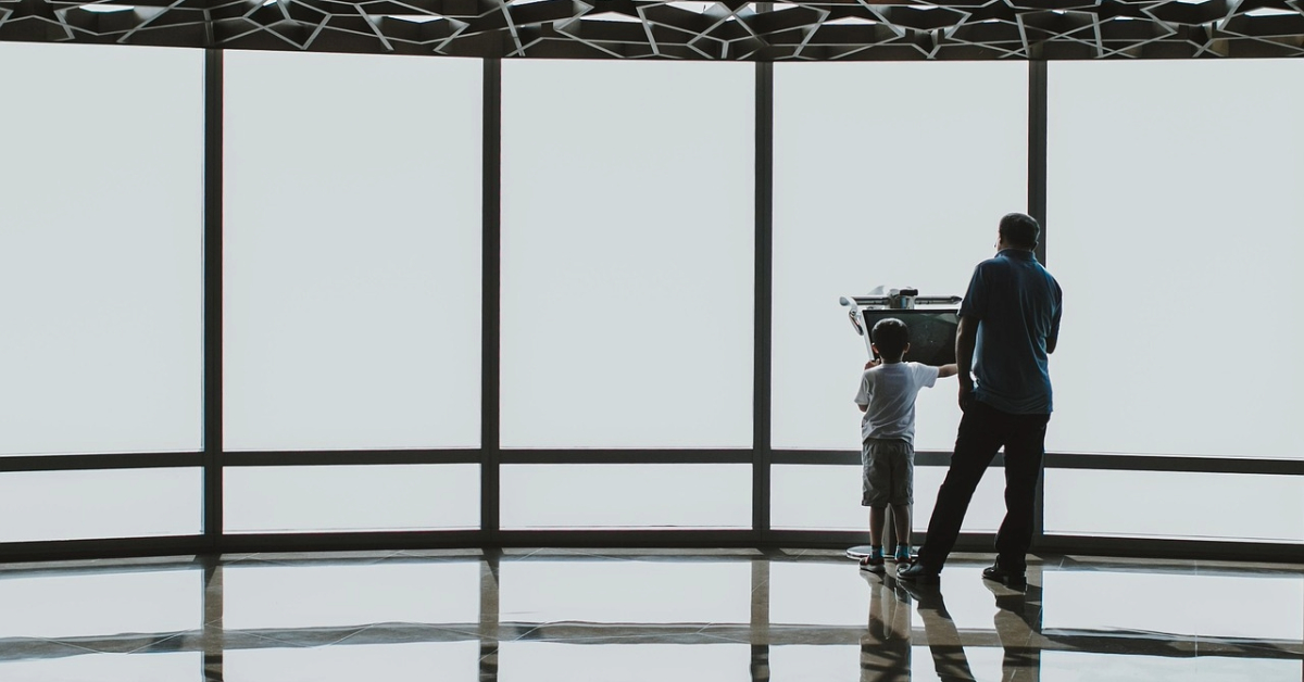 father and child at an observation deck in the Burj Khalifa in Dubai, United Arab Emirates