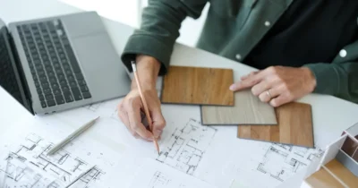 woman looking at buildings plan to investigate Dubai building codes