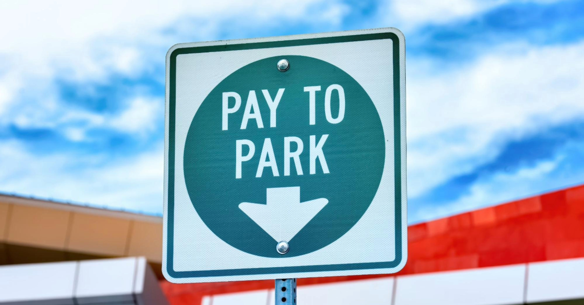Parking sign says pay to park