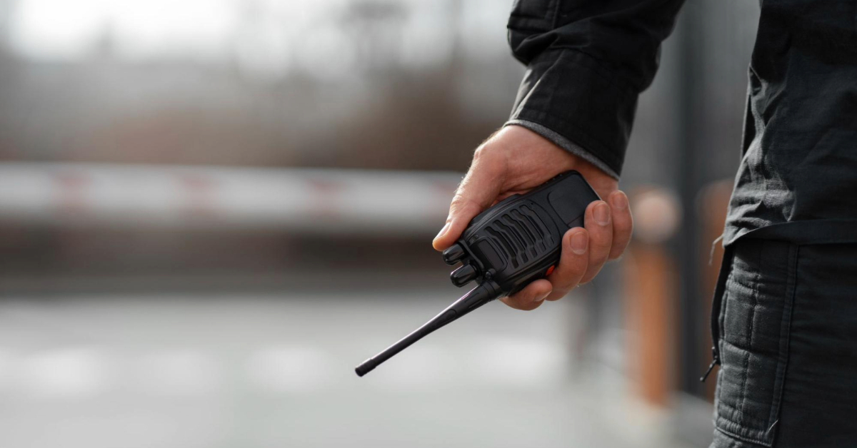 Police officer holding a radio in the dubai police academy