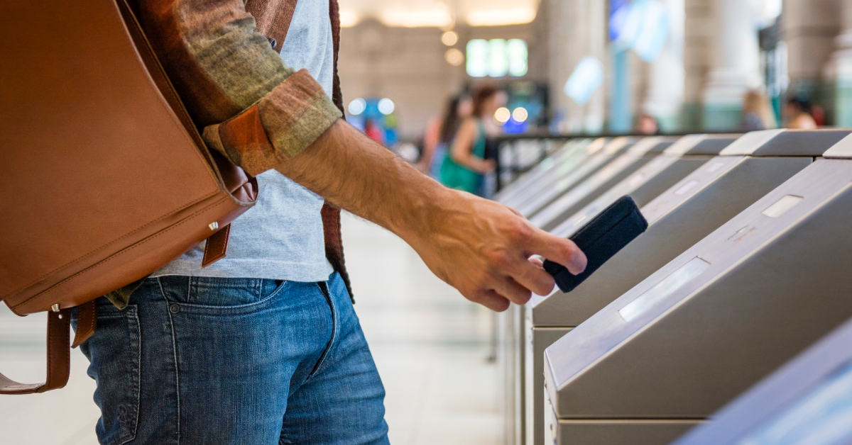 A man checking in with a metro card