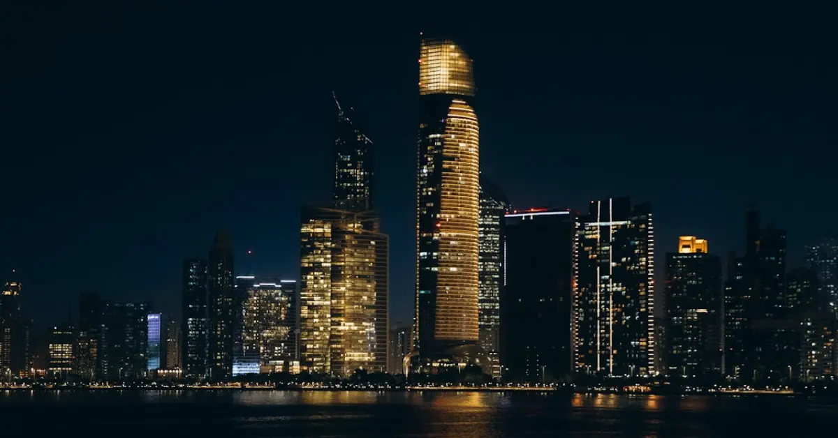 Abu Dhabi city skyline at night with illuminated skyscrapers