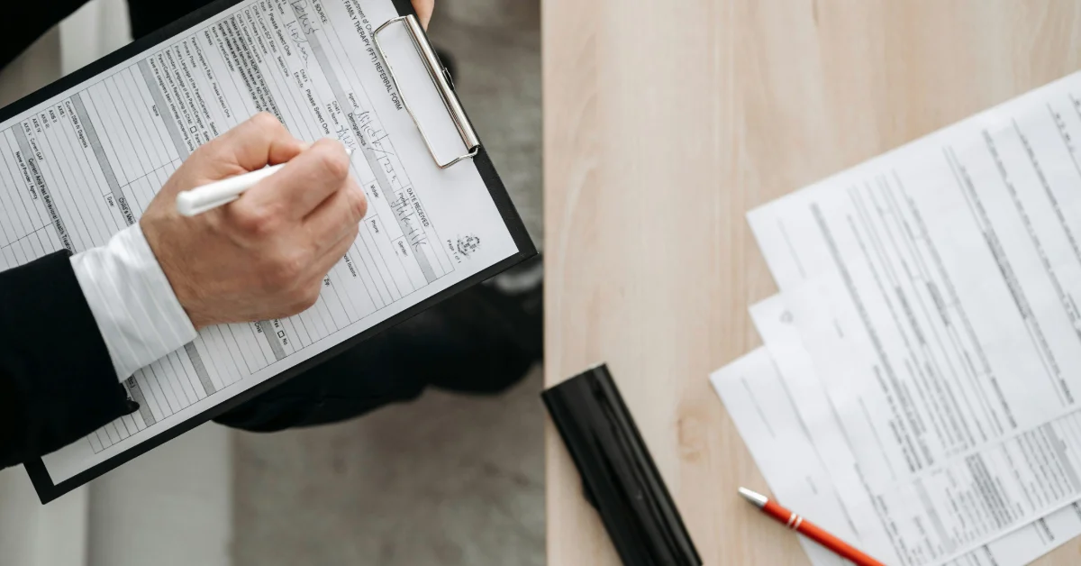 Agent verifying tenant’s financial statements.