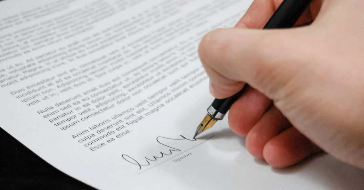 Person Signing in Documentation Paper