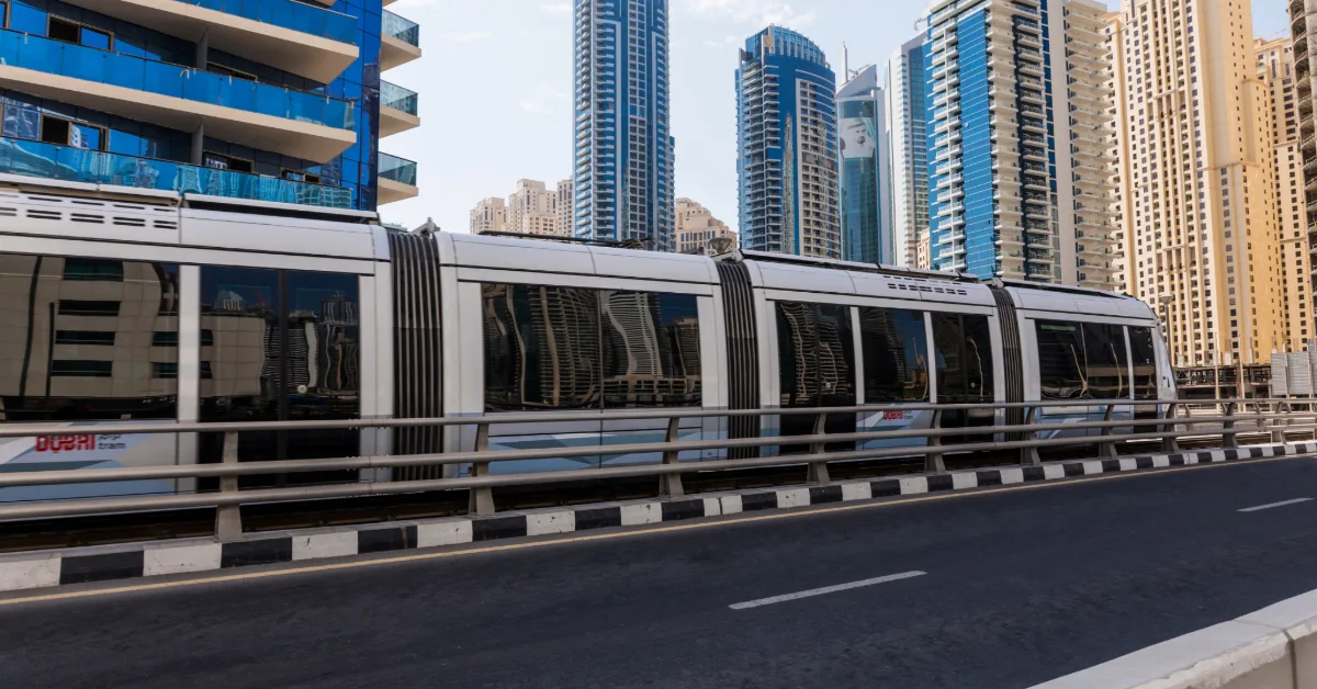 The Dubai Metro passes between the modern towers