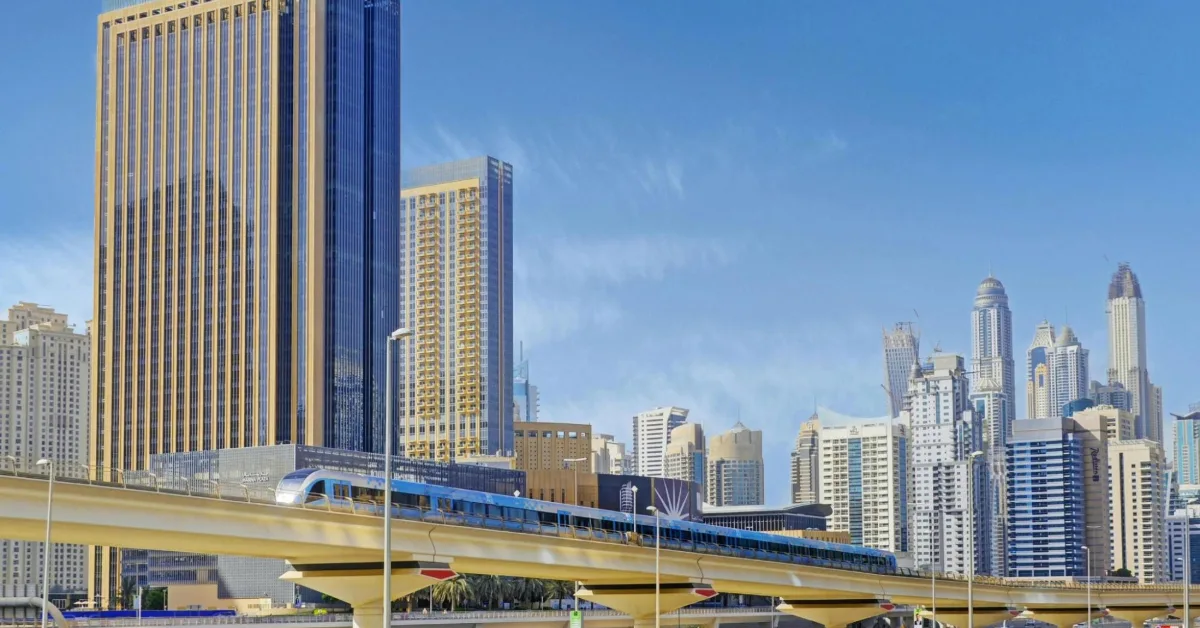 Dubai metro train on elevated tracks in the city