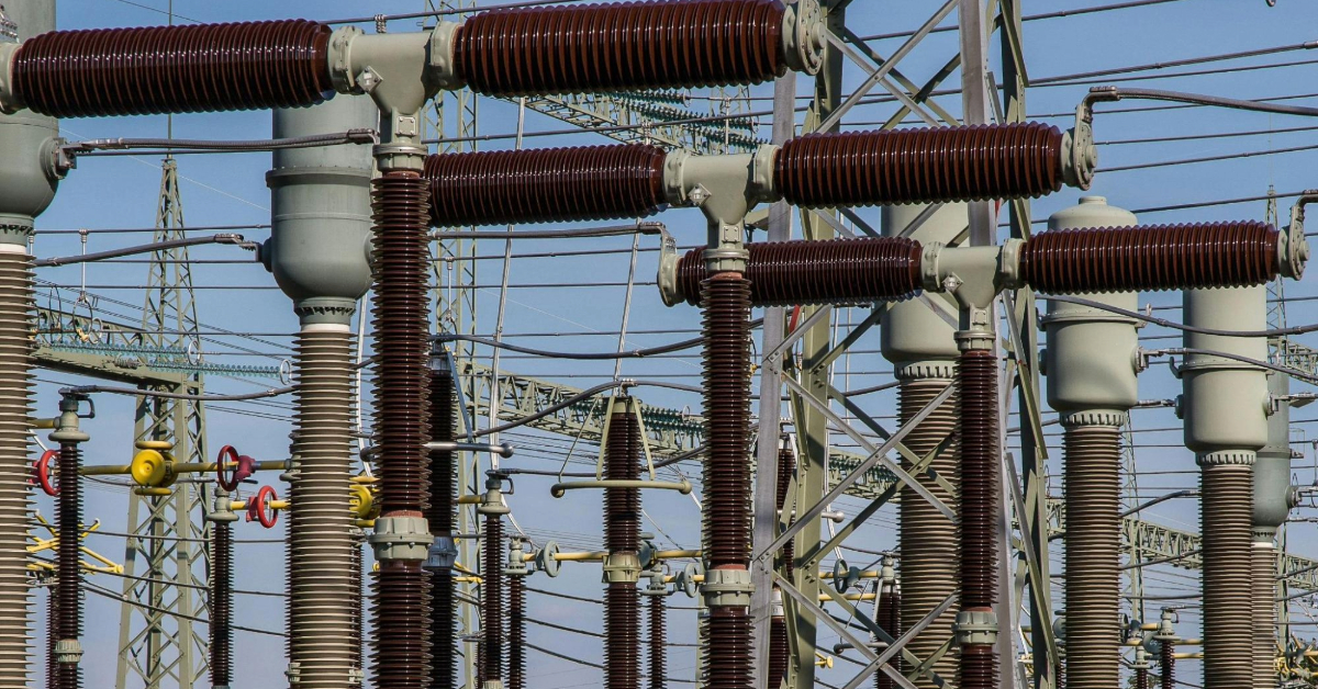 A large group of tangled electrical wires and poles