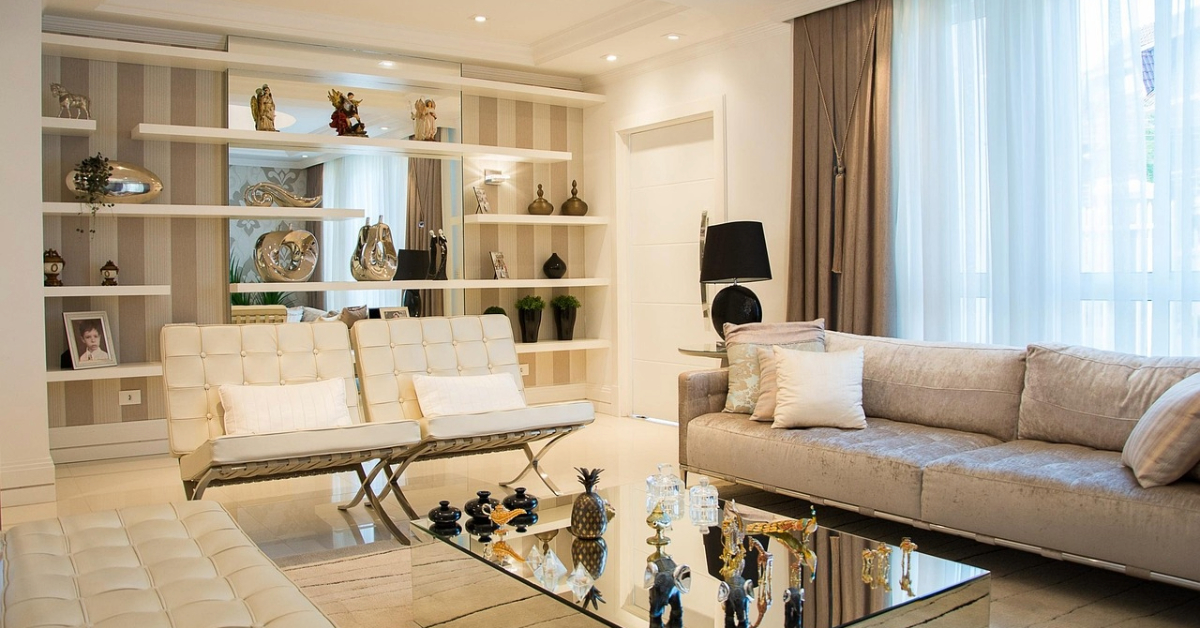 Modern living room with elegant decor, a mirror, and soft ambient lighting