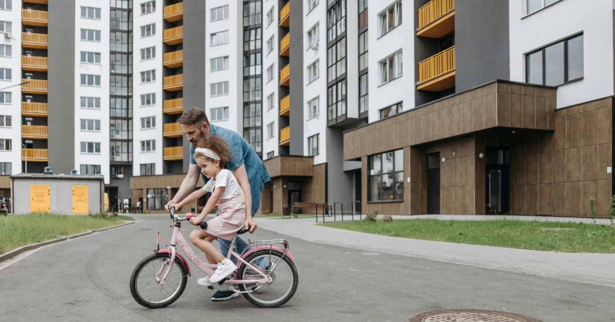 girl learning to ride a bike