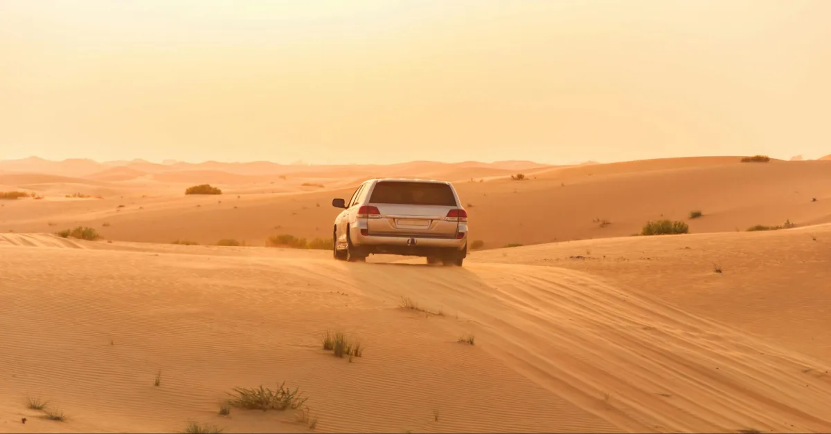 A car driving through UAE Desert