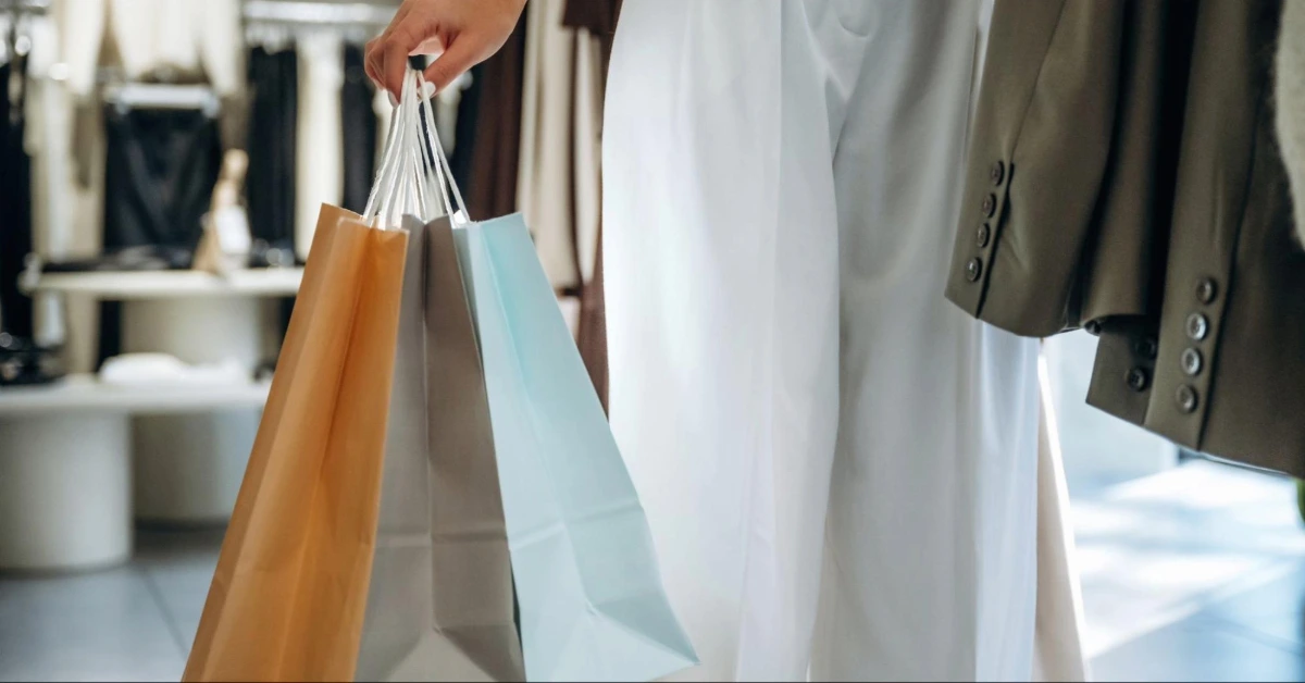 Women holding shopping bags in a clothes store
