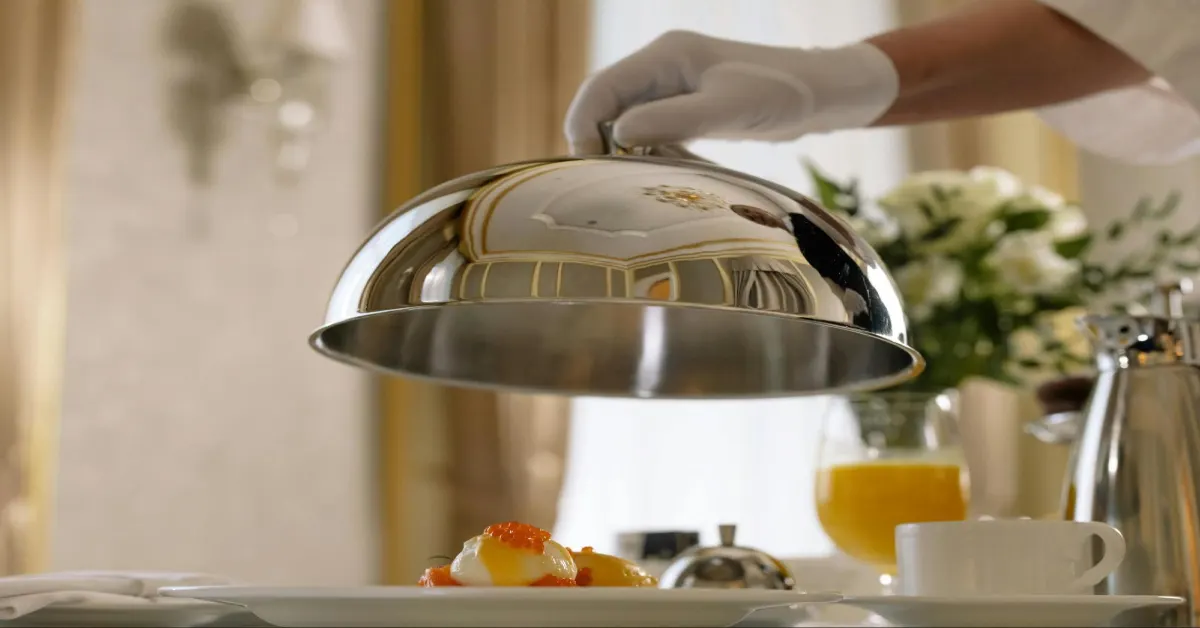 A chief presenting a fancy dish