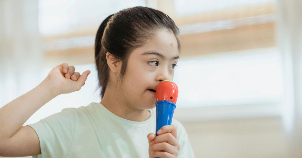 A kid with special needs enjoying singing