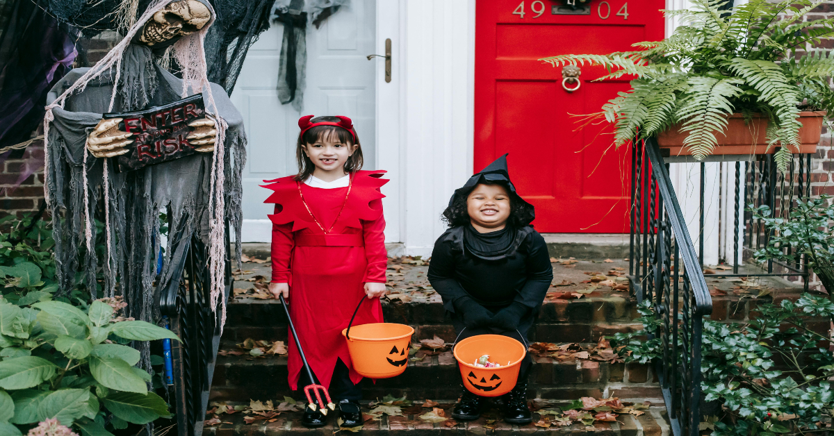 Happy kids in Halloween costumes