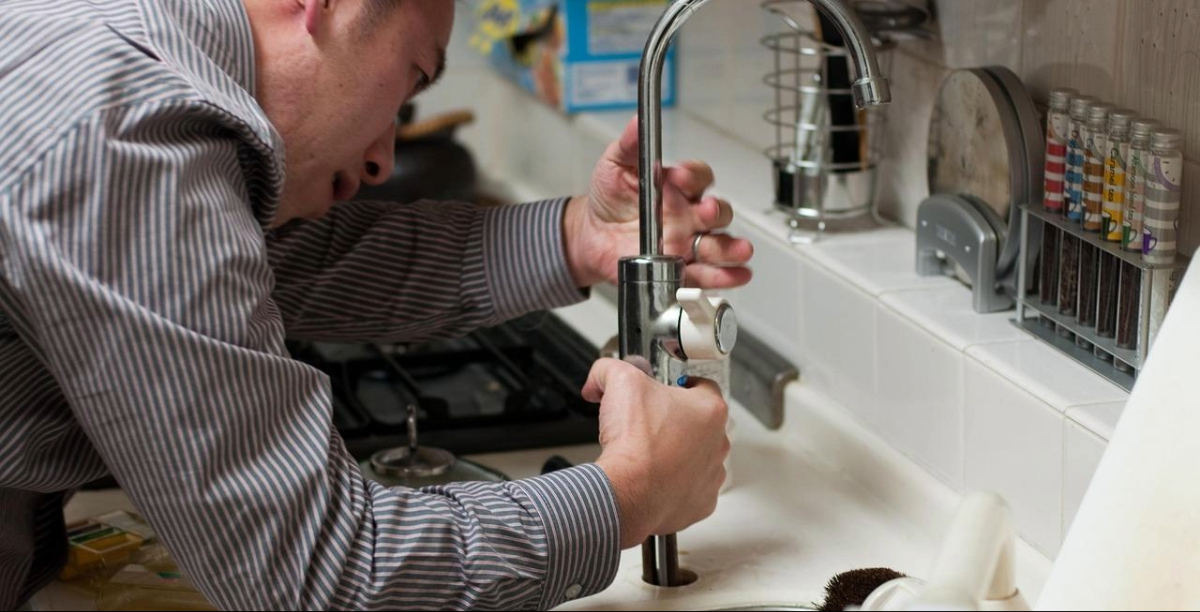 plumber working on bathroom to show where does bathroom renovations costs in dubai go 