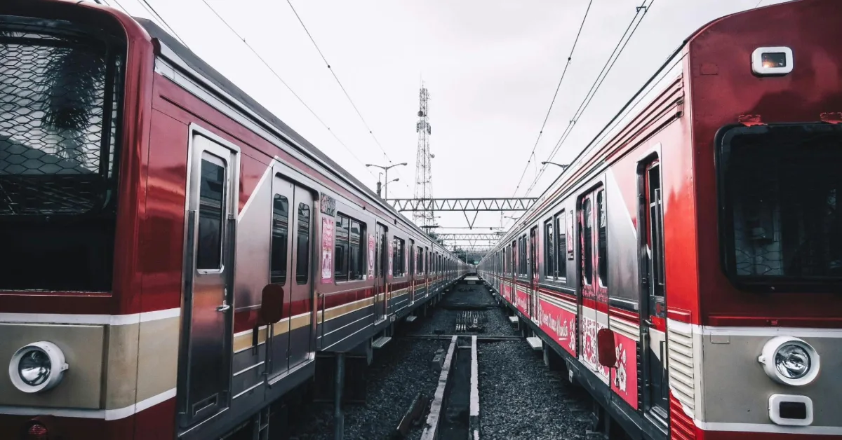 Two metro trains parked side by side at a station in Dubai