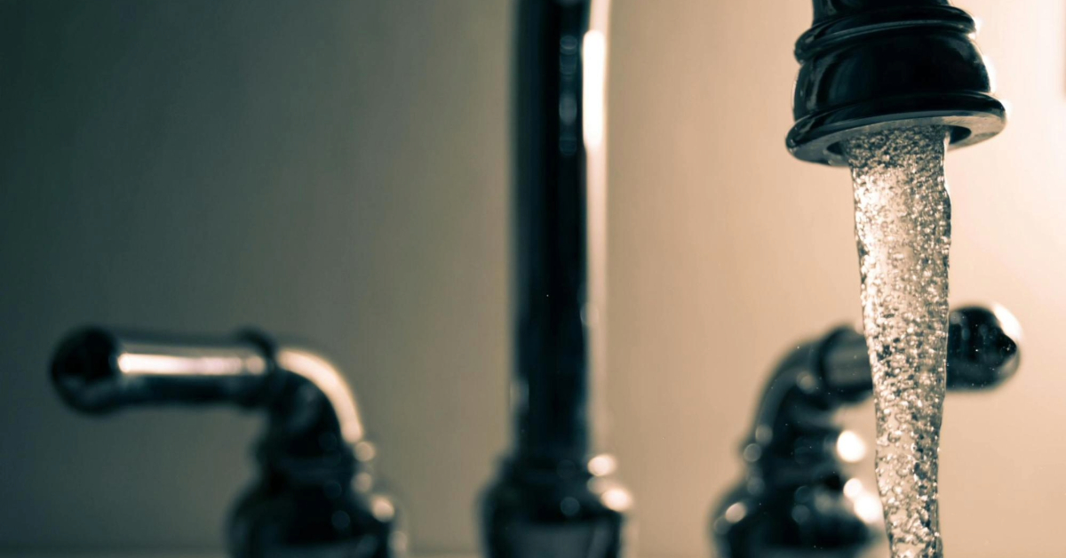 Close-up of a faucet with water running