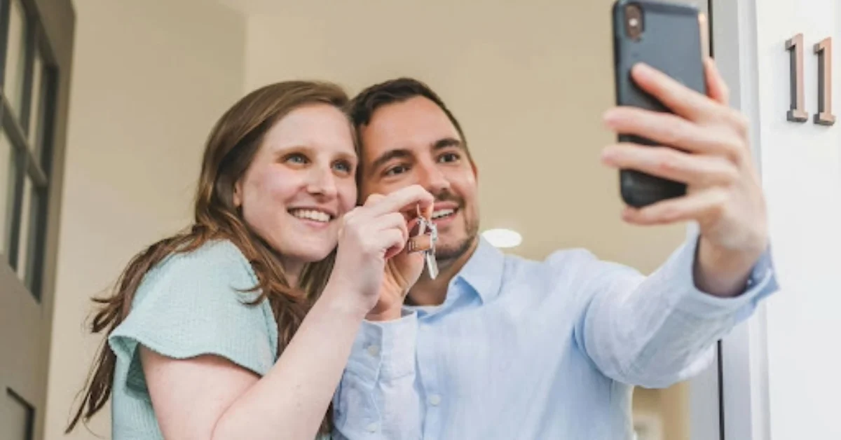 A couple taking a selfie in their new home 