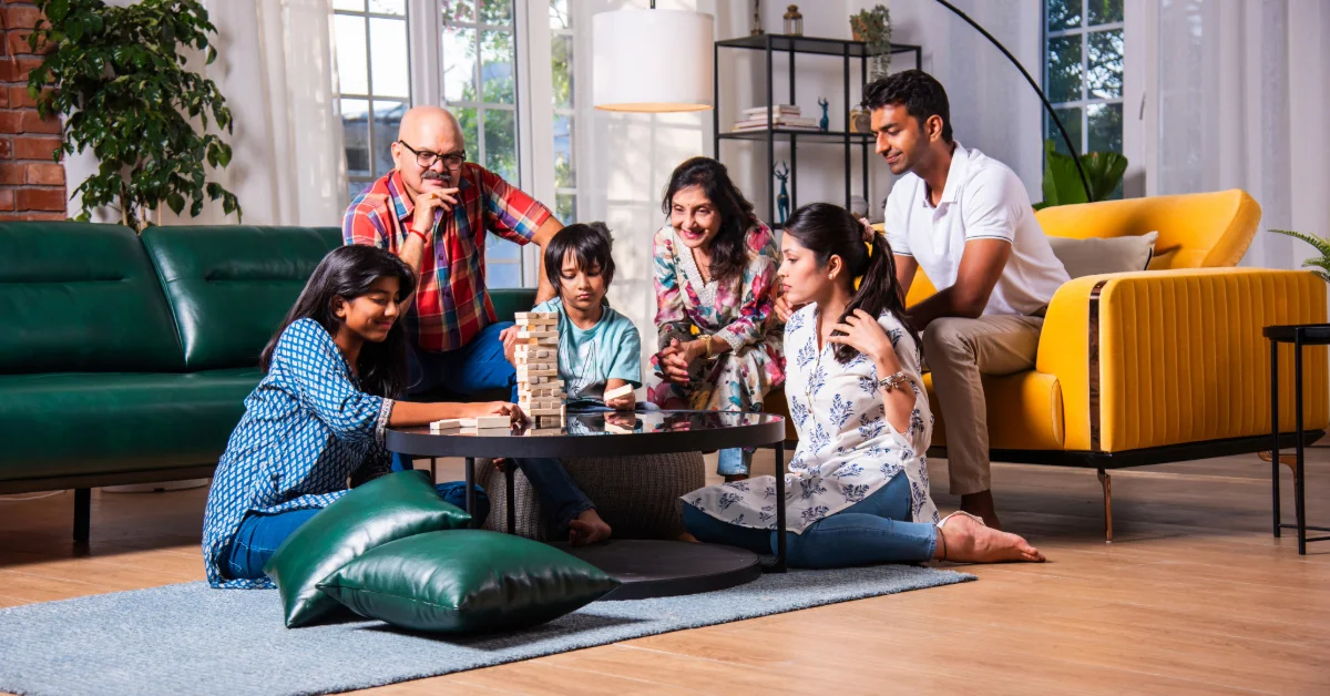 Family playing a board game in their house in Fujairah