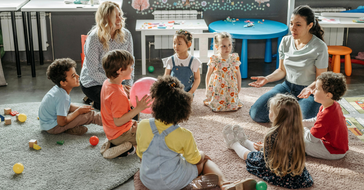 Kids playing with their teachers in a Dubai South nursery 