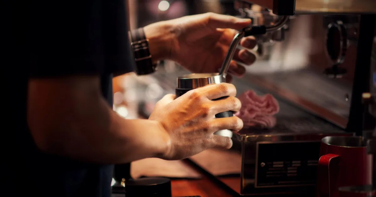 Barista brewing coffee