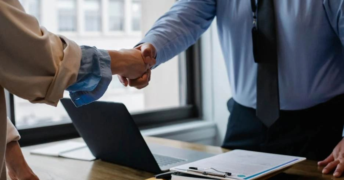 Business handshake in a Dubai real estate office