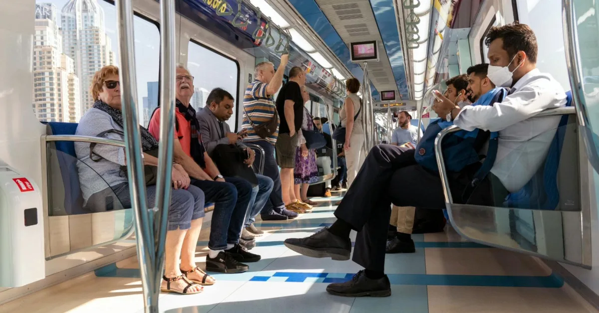 Commuters on a Dubai Metro train