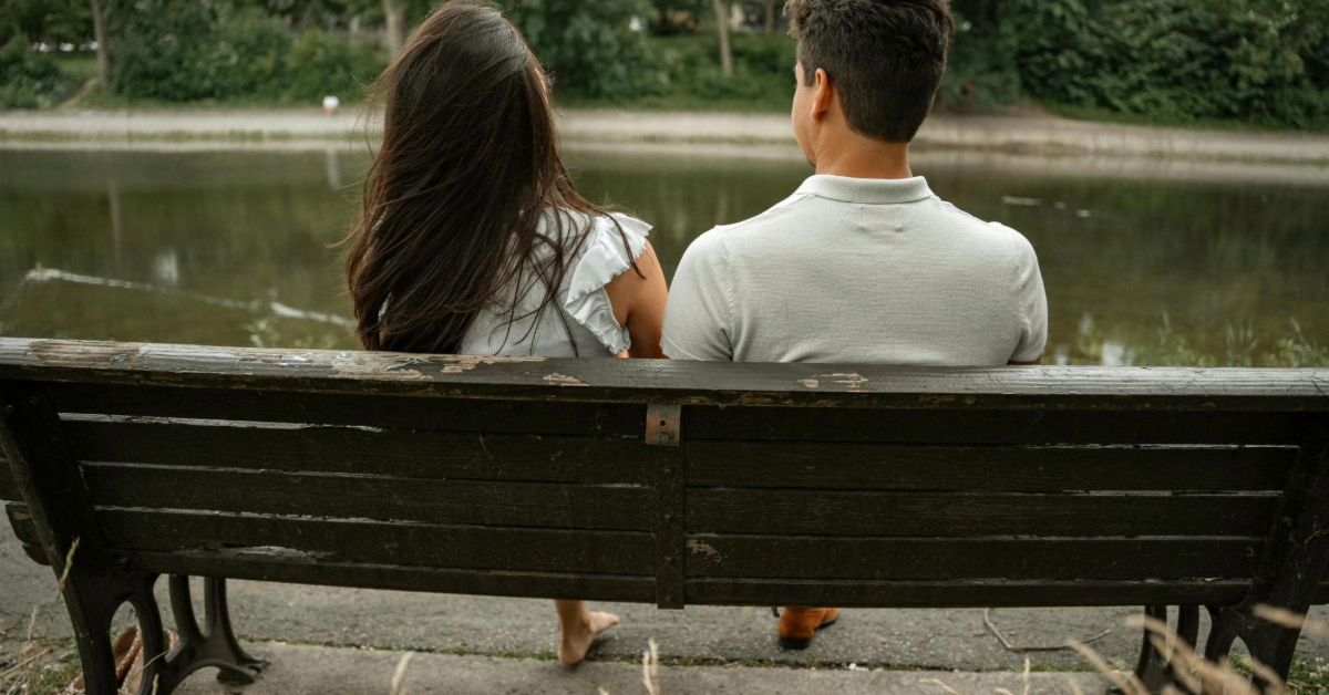 Couple on Bench by Pond in Park
