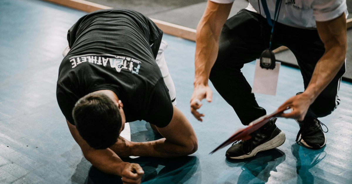 Man Exercising with a Trainer