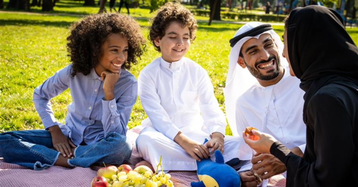 Family on a picnic in a green park