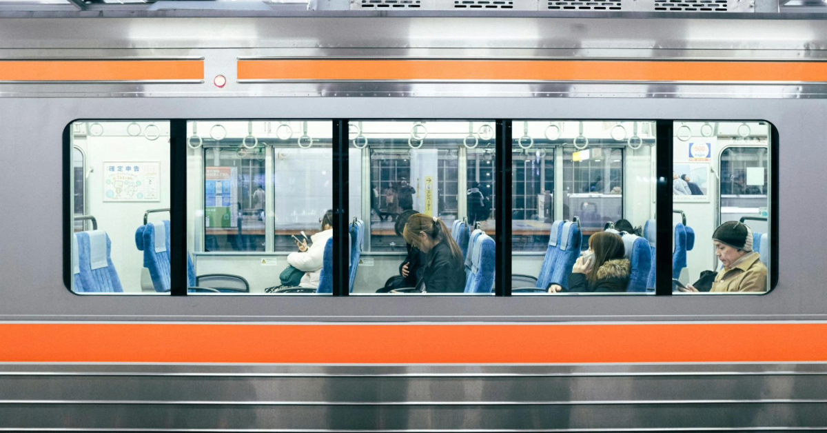 Passengers behind Metro Train Windows