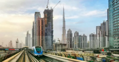 The Dubai Metro running alongside the iconic Dubai skyline