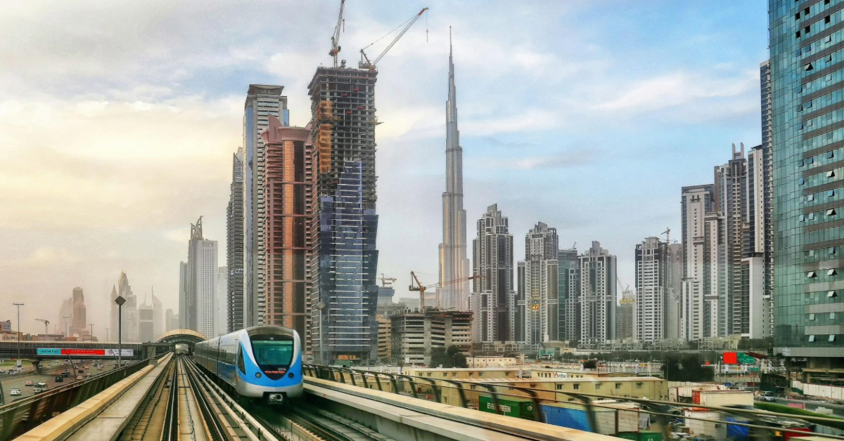 The Dubai Metro running alongside the iconic Dubai skyline