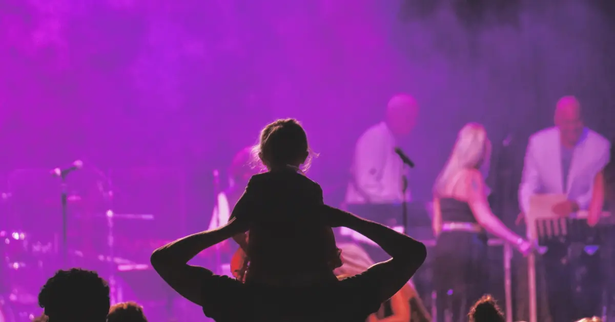 Father and daughter at a Sole DXB concert