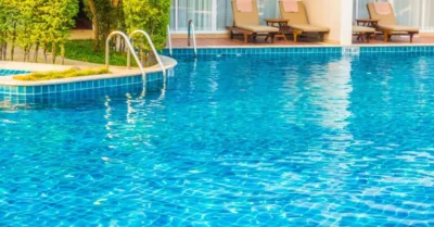 A clean swimming pool with sparkling clear water, ready for swimming.