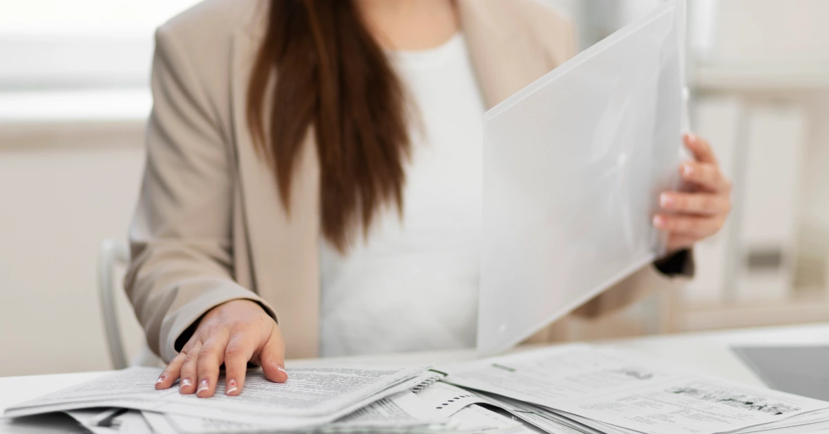 Women organizing real estate documents