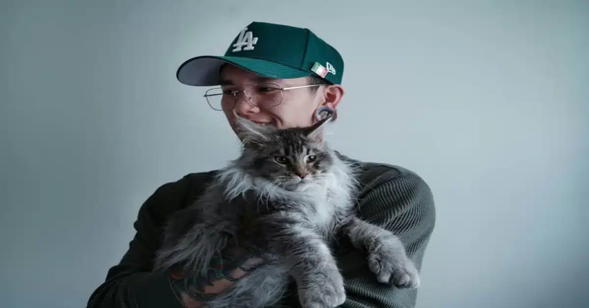 A person holding a cat