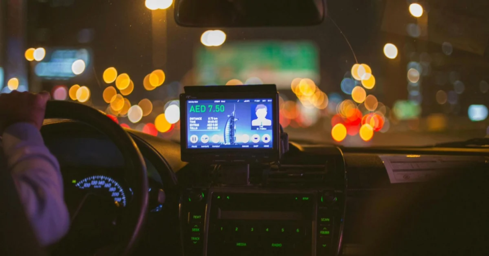Taxi Ride Price Displayed on Screen on Dashboard in Car