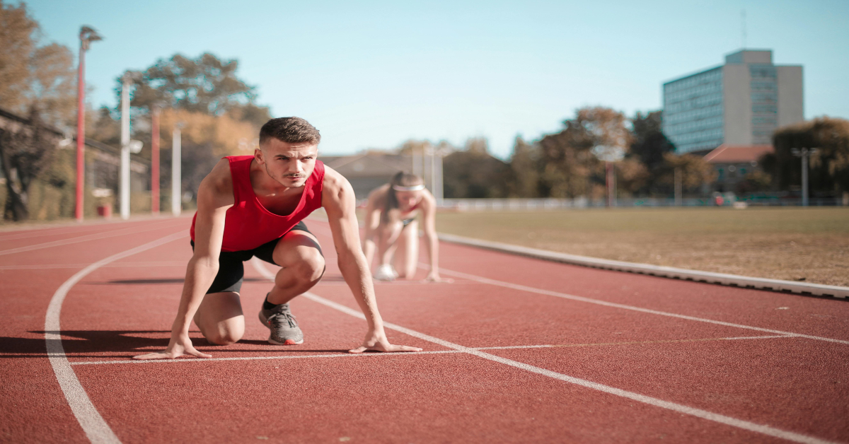 A man getting ready to start running