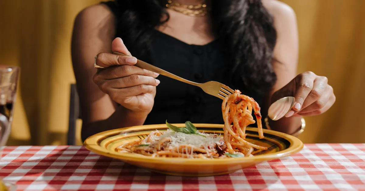 Woman eating in restaurant