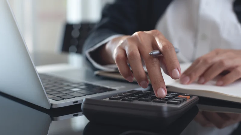woman calculating how to downsize a home for profit
