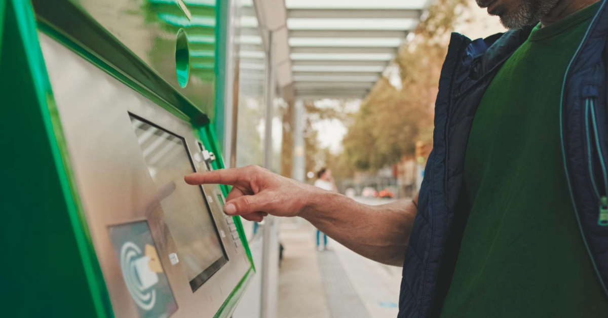 a man topping up his card for transportation