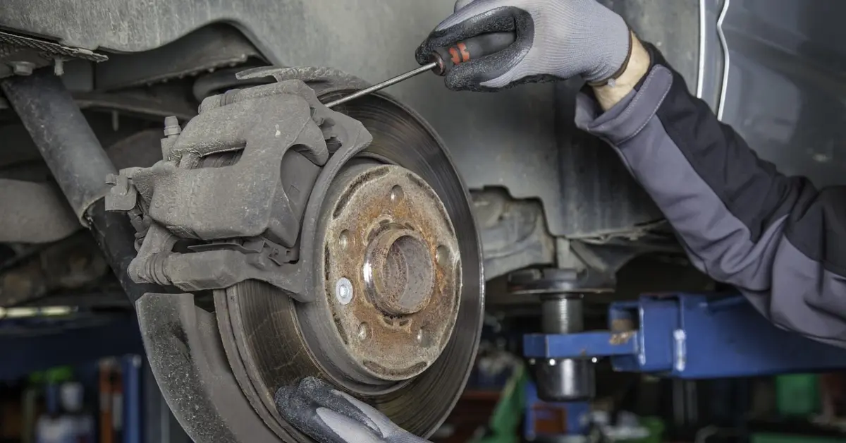 A car being repaired by a mechanic in Sharjah