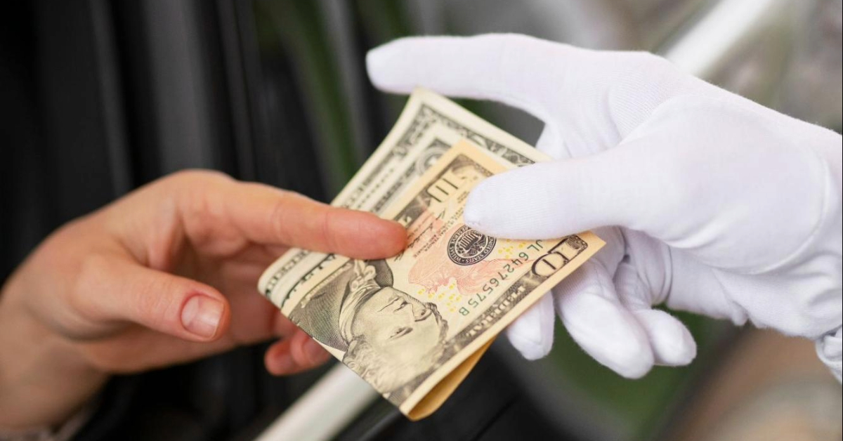 A tow truck transporting a broken down car