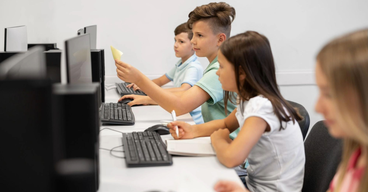 Children learning in a computer lab