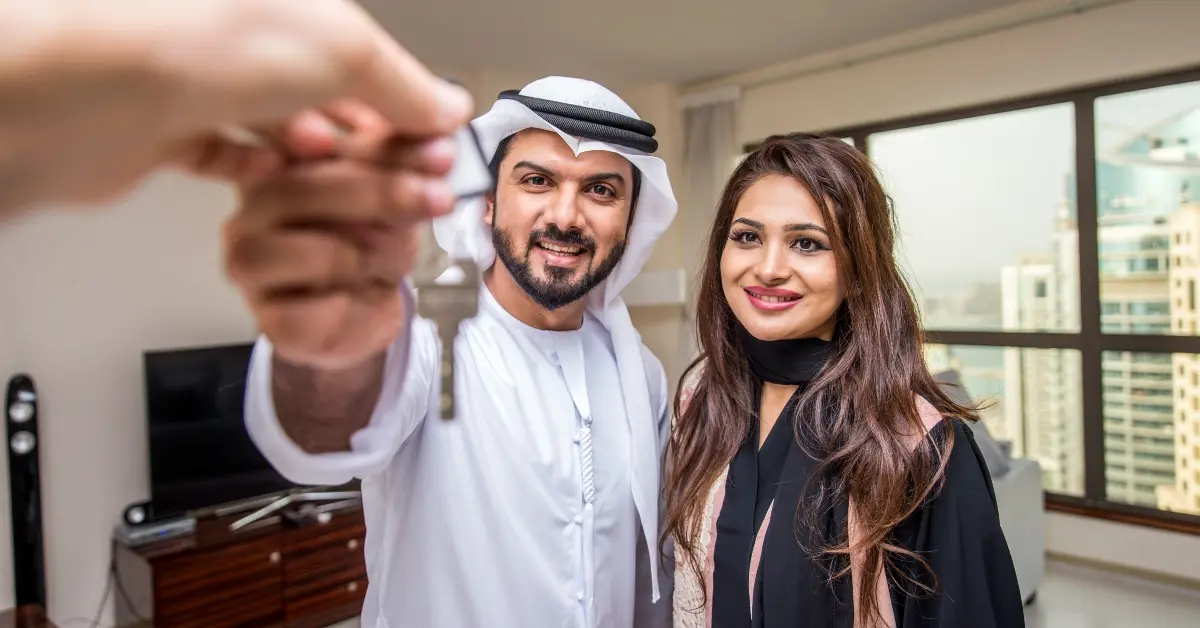 Couple receiving their new home key